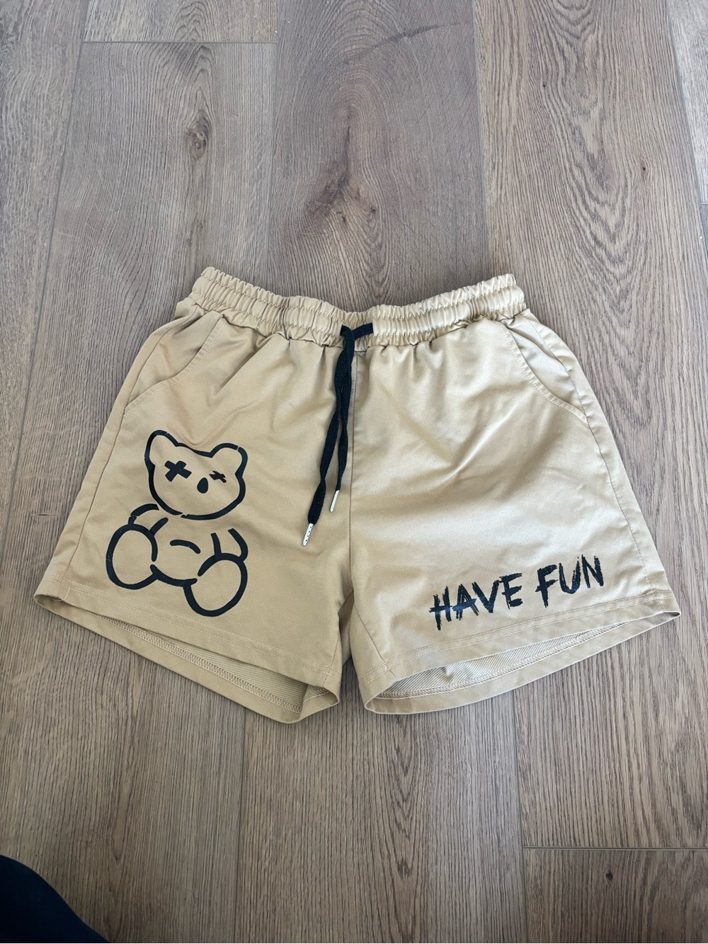SHEIN Beige Men's Athletic Shorts with Black Teddy Graphic